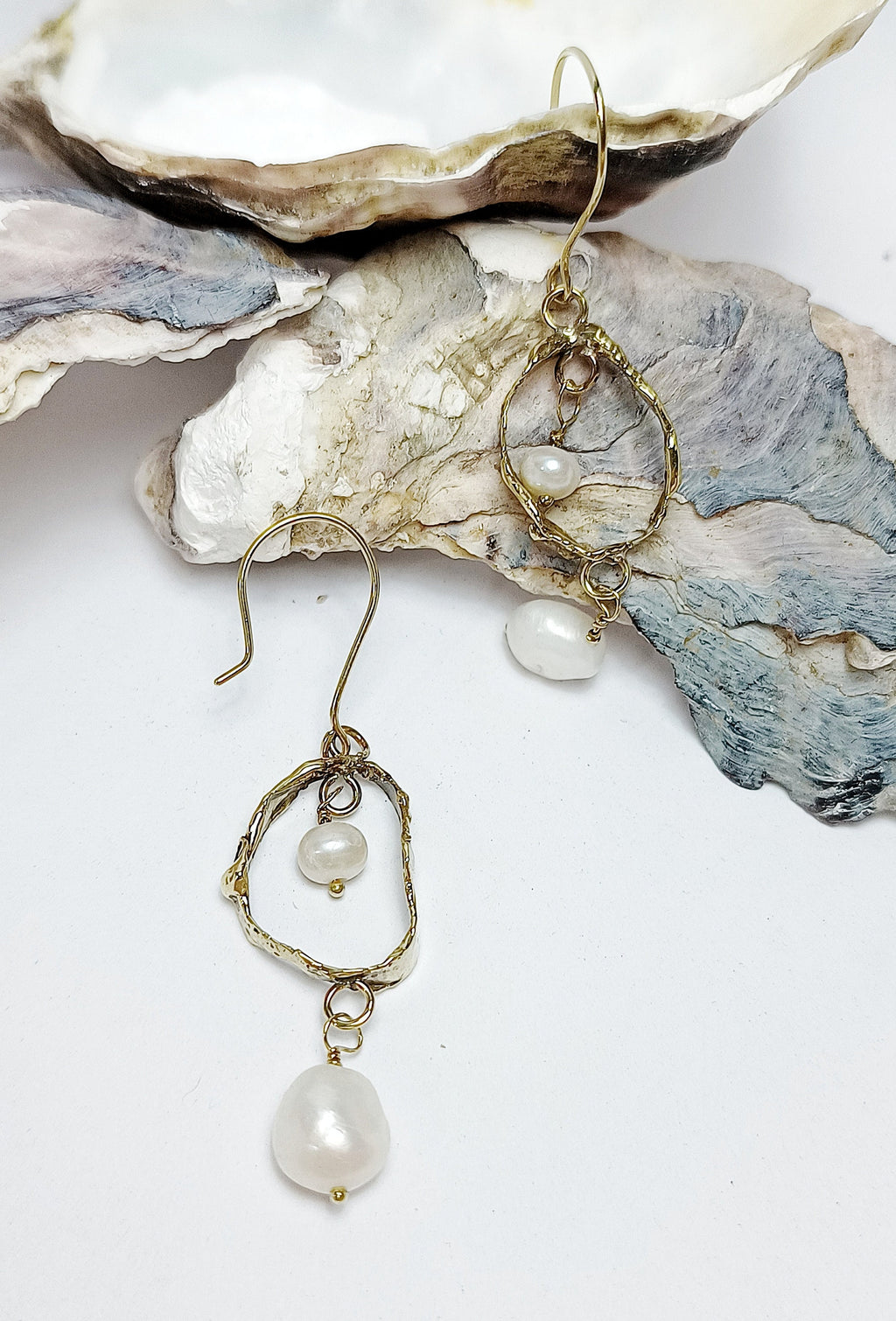 FEMME dangly double pearl earrings